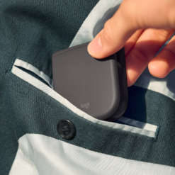 Logitech Mobi Fold mouse Graphite folded and slipping into a pocket